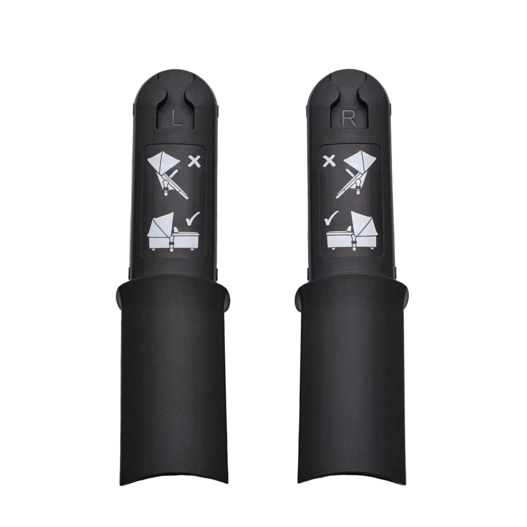 Two black baby carrier adapter sleeves, labeled L and R, with white printed instructions showing how to attach a stroller and bassinet, set against a light gray background.