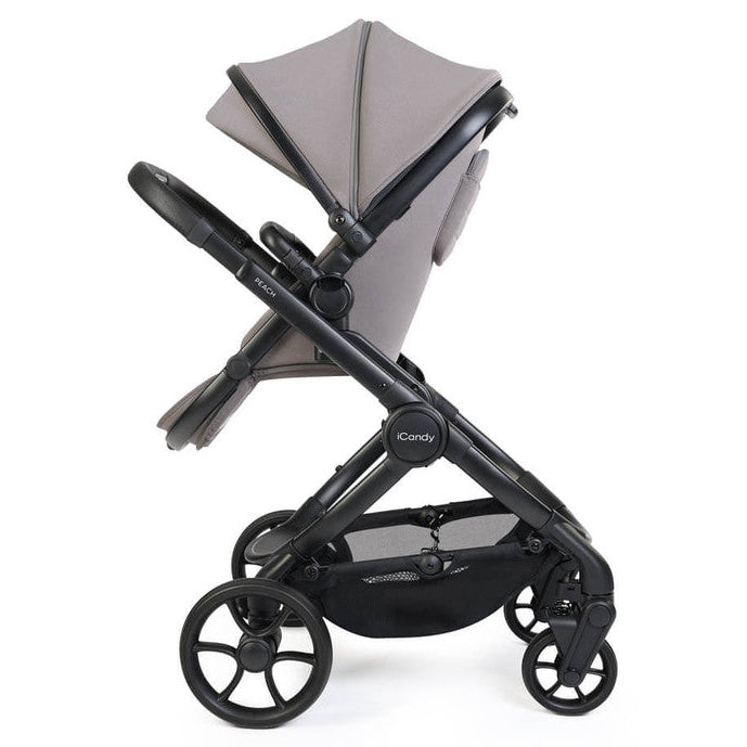 Gray and black stroller on a white background