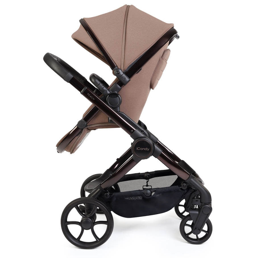 Brown and black stroller on a white background