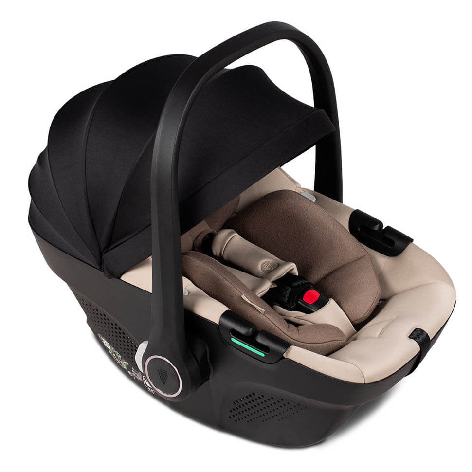 Black and beige baby car seat on a white background