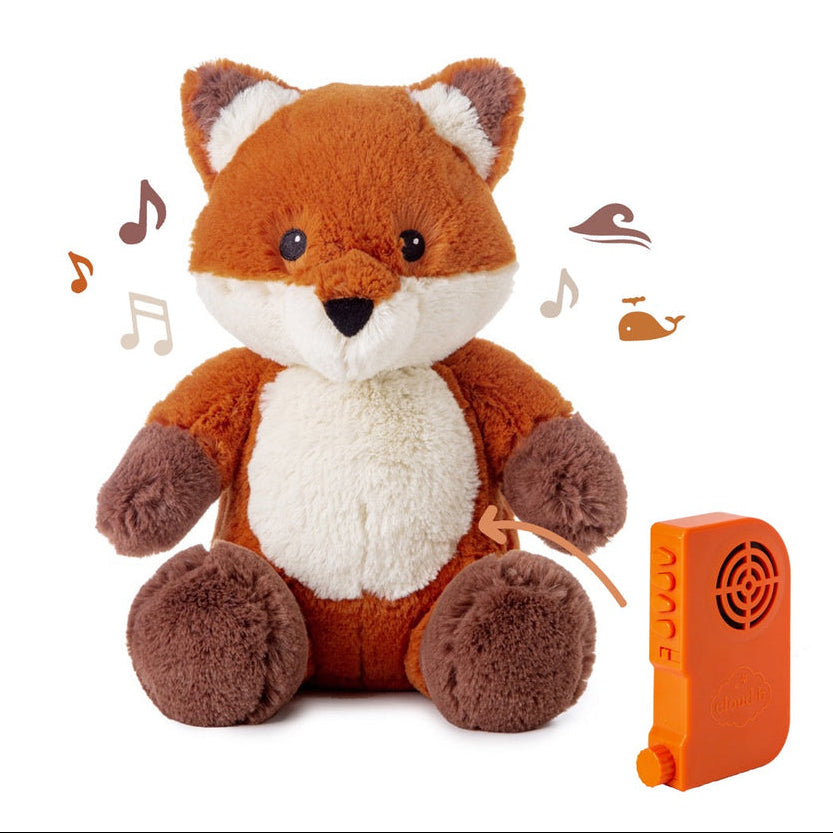 Plush fox toy with a remote control on a white background