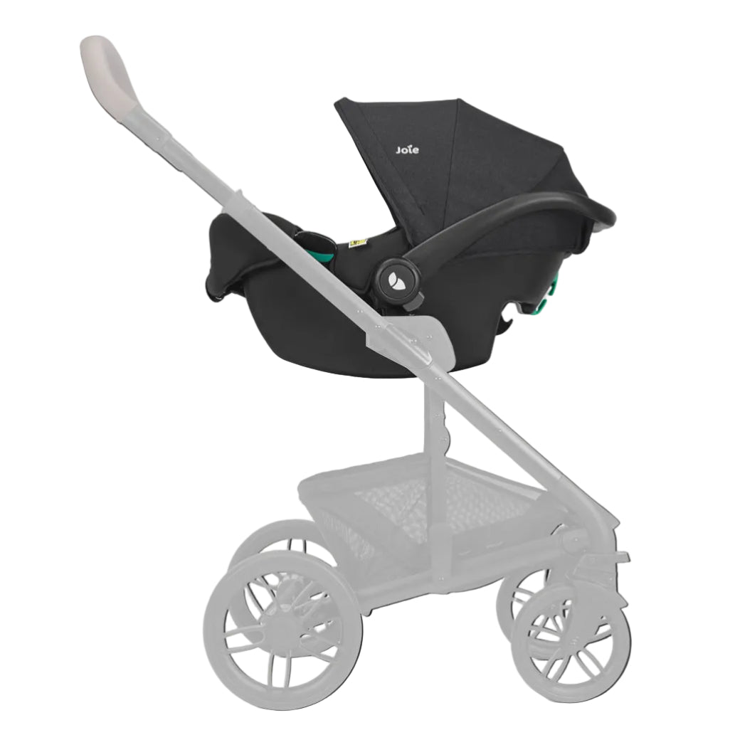 A black stroller bassinet combo from Bugaboo, shown mounted on a light gray stroller frame against a solid off-white background.