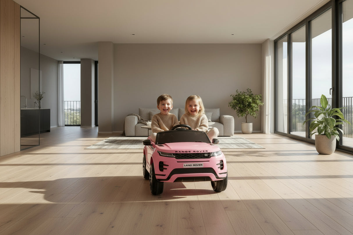 Pink toy car modeled after a luxury vehicle on a white background
