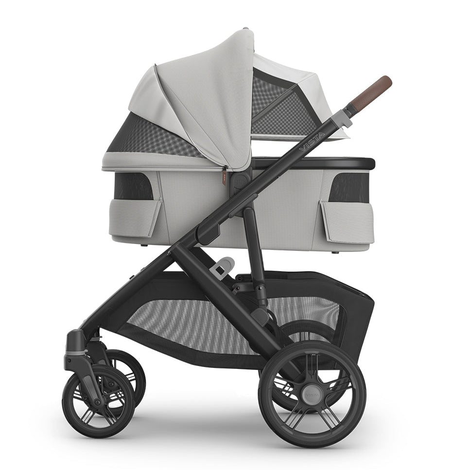 Gray and black stroller on a white background
