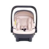 A baby car seat with a dark gray plastic base and handle, upholstered in a light beige fabric, shown from a front-facing perspective on a white background.
