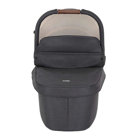 Gray baby carrier with beige interior on a white background