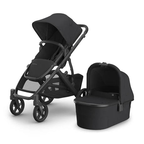 Black stroller with bassinet on a white background