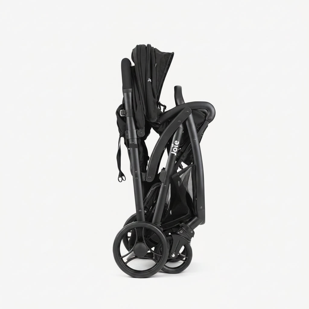 Black stroller folded and compact on a white background