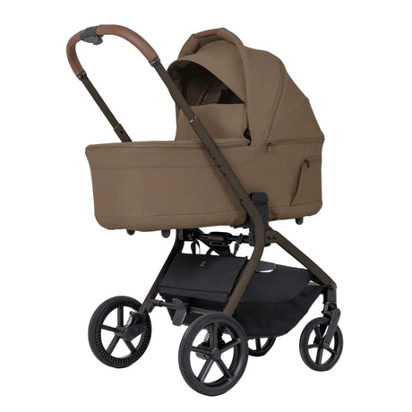 Brown baby stroller with canopy on a white background