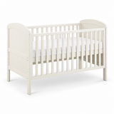 An off-white wooden convertible crib with a mattress, shown from a three-quarter angle on a clean white background.