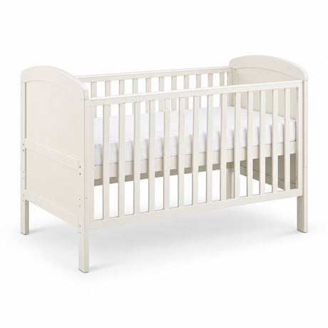 An off-white wooden convertible crib with a mattress, shown from a three-quarter angle on a clean white background.