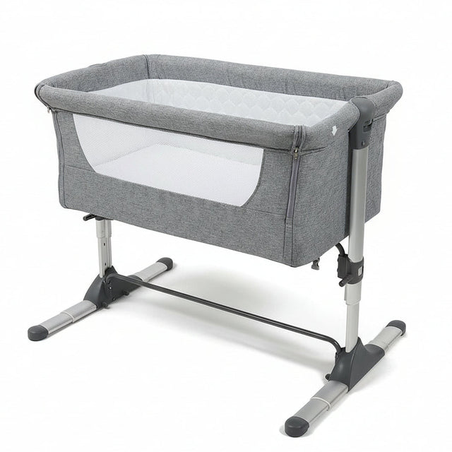 Gray baby crib with white mattress on a white background