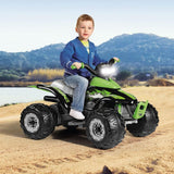 Child sitting on a green toy ATV in a natural setting with mountains and water in the background