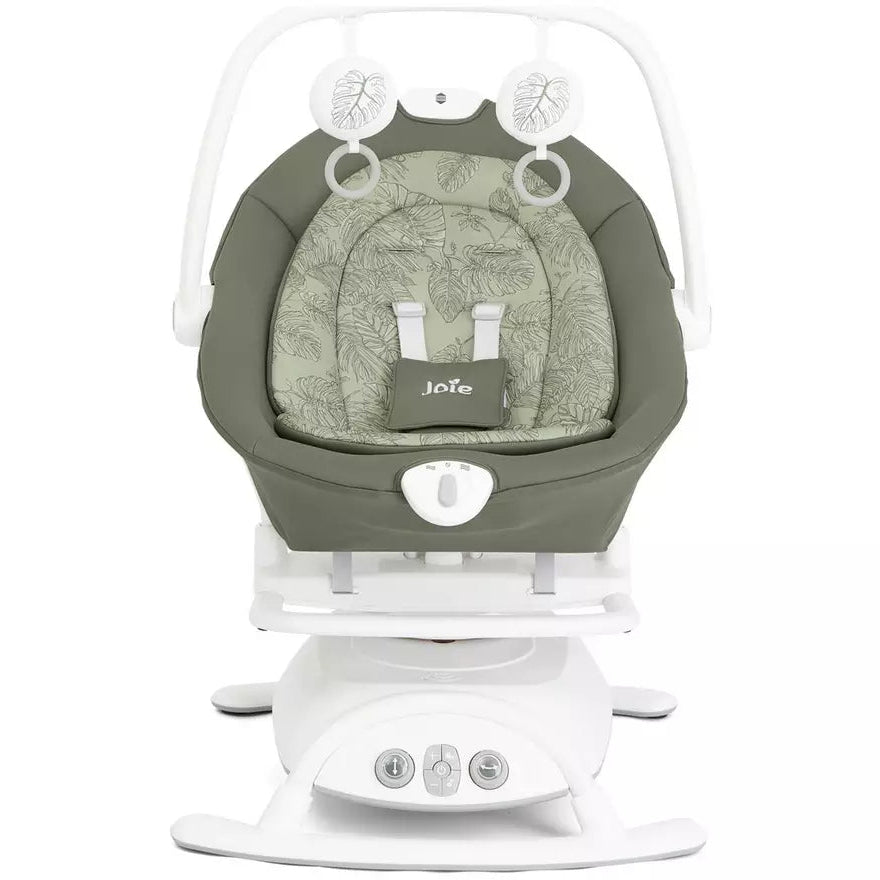 A Jula baby swing and seat bassinet combo in sage green and white, featuring a padded seat cushion with the Jula logo, a white rocking base, and a white safety harness frame.