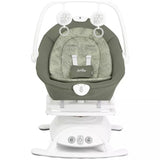 A Jula baby swing and seat bassinet combo in sage green and white, featuring a padded seat cushion with the Jula logo, a white rocking base, and a white safety harness frame.