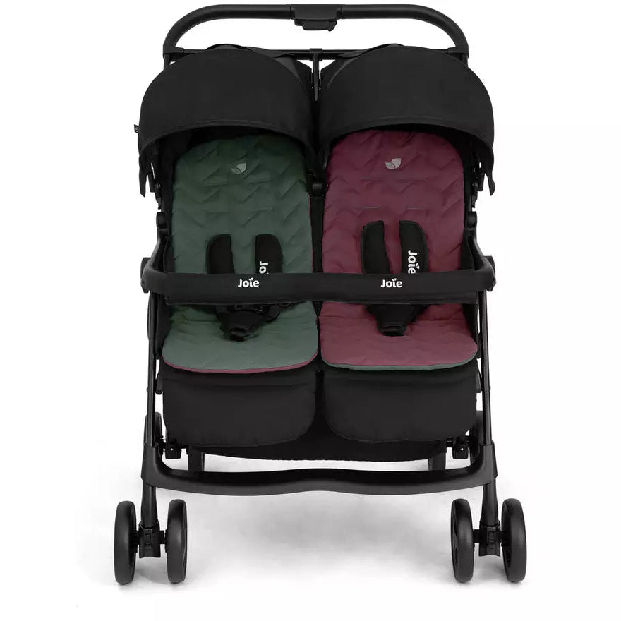 A double stroller with a black frame and canopy, featuring two separate seats with quilted cushions in dark green and burgundy, shown against a plain white background.