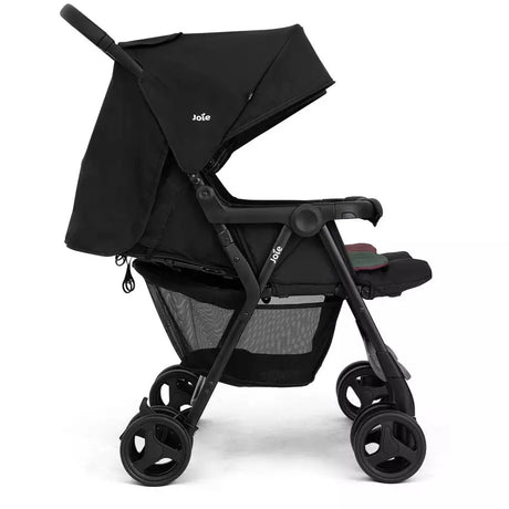 A black baby stroller with a matching black canopy, shown from a side profile on a clean white background. The stroller features a black frame, black wheels, and a mesh storage basket underneath.