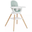 A modern high chair with a white plastic seat and tray, a mint green padded backrest, and four natural wood legs, shown against a plain white background.