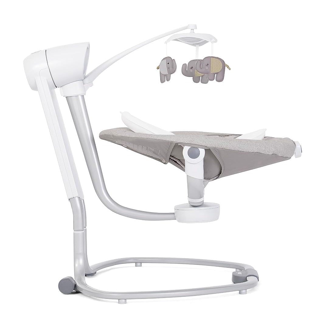 A modern baby bassinet with an adjustable white frame, a gray fabric cushion, and a matching elephant-themed hanging mobile, shown against a solid white background.