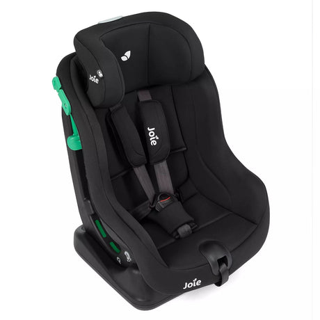 A Joie brand black infant car seat with green side-release latches, shown at a three-quarter angle on a solid white background.
