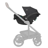 A black stroller bassinet combo from Bugaboo, shown mounted on a light gray stroller frame against a solid off-white background.