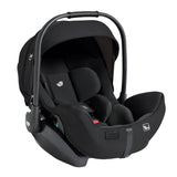 A black infant car seat with a matching canopy and harness, shown from a three-quarter angle on a solid white background.