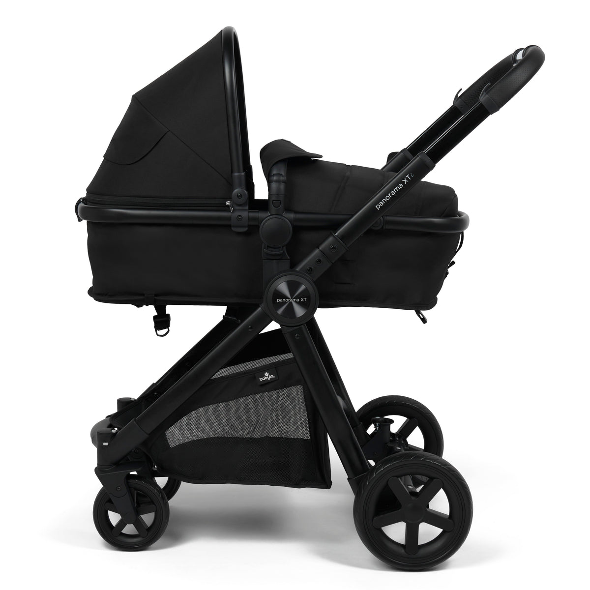 A black stroller and bassinet travel system on a clean white background. The stroller features a black bassinet, a black canopy, a black frame, and black wheels, with a gray mesh storage pocket on the lower basket.