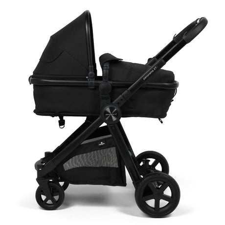 A black stroller and bassinet travel system on a clean white background. The stroller features a black bassinet, a black canopy, a black frame, and black wheels, with a gray mesh storage pocket on the lower basket.
