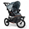 Gray and black stroller on a white background