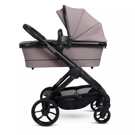 Baby stroller with beige canopy on a white background