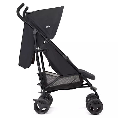 A black Joie stroller with a matching black canopy, mesh seat liner, and black wheels, shown from a side profile view on a solid white background.