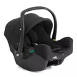 A black Jole infant car seat with a matching black travel harness and canopy, shown from a three-quarters angle on a solid white background.