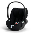 Black baby car seat on a white background