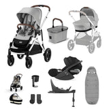 A multi-item baby travel system set in gray, black, and white, including two strollers, a car seat, a bassinet, a storage basket, a footmuff, a cup holder, and accessories, arranged on a clean white background.