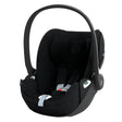 Black baby car seat on a white background