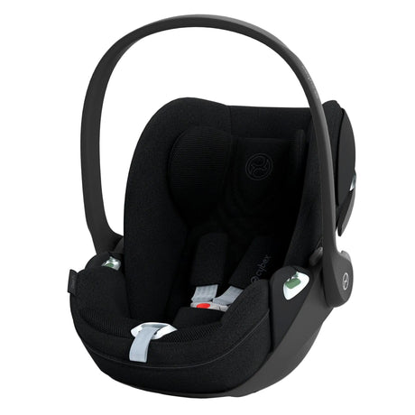 Black baby car seat on a white background
