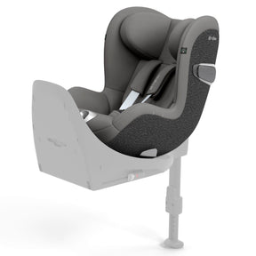 A grey and black baby car seat mounted on a light grey base, shown from a three-quarters angle against a solid white background.
