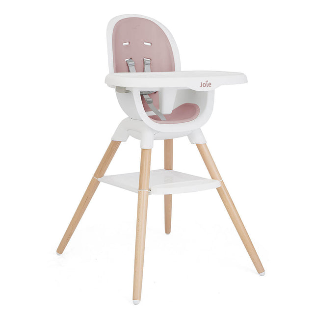 Pink and white high chair with wooden legs on a white background