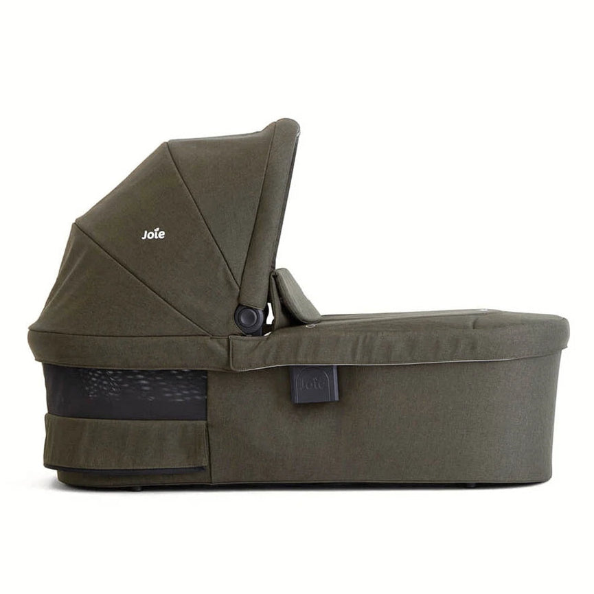 An olive green baby bassinet with a matching hooded canopy, shown from a side profile on a clean white background. The brand name 'Joie' is visible on the canopy.