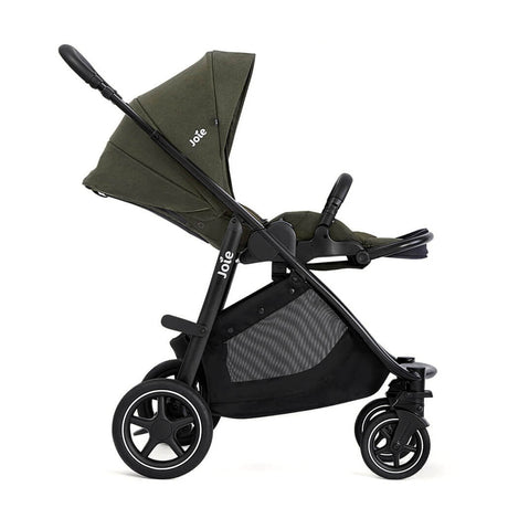 Green and black stroller with Joie branding on a white background