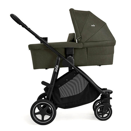 Green baby stroller with black frame on a white background