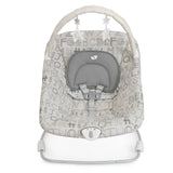 A baby rocking seat with a white and gray alphabet patterned fabric, featuring a gray padded headrest, adjustable straps, and a white metal base with an arch overhead.