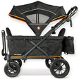 Black and orange stroller wagon with canopy on a white background