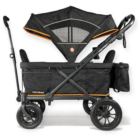 A black stroller wagon with orange accents, featuring a large black canopy, four wheels, and a side storage pocket, shown on a white background.