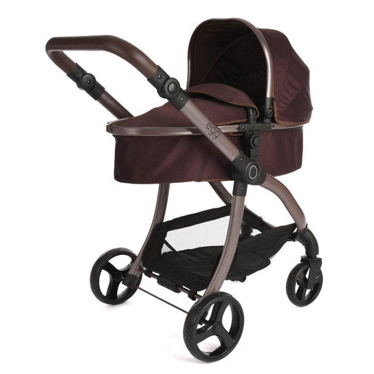 Brown baby stroller on a white background