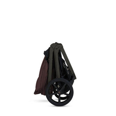 Folded stroller on a white background